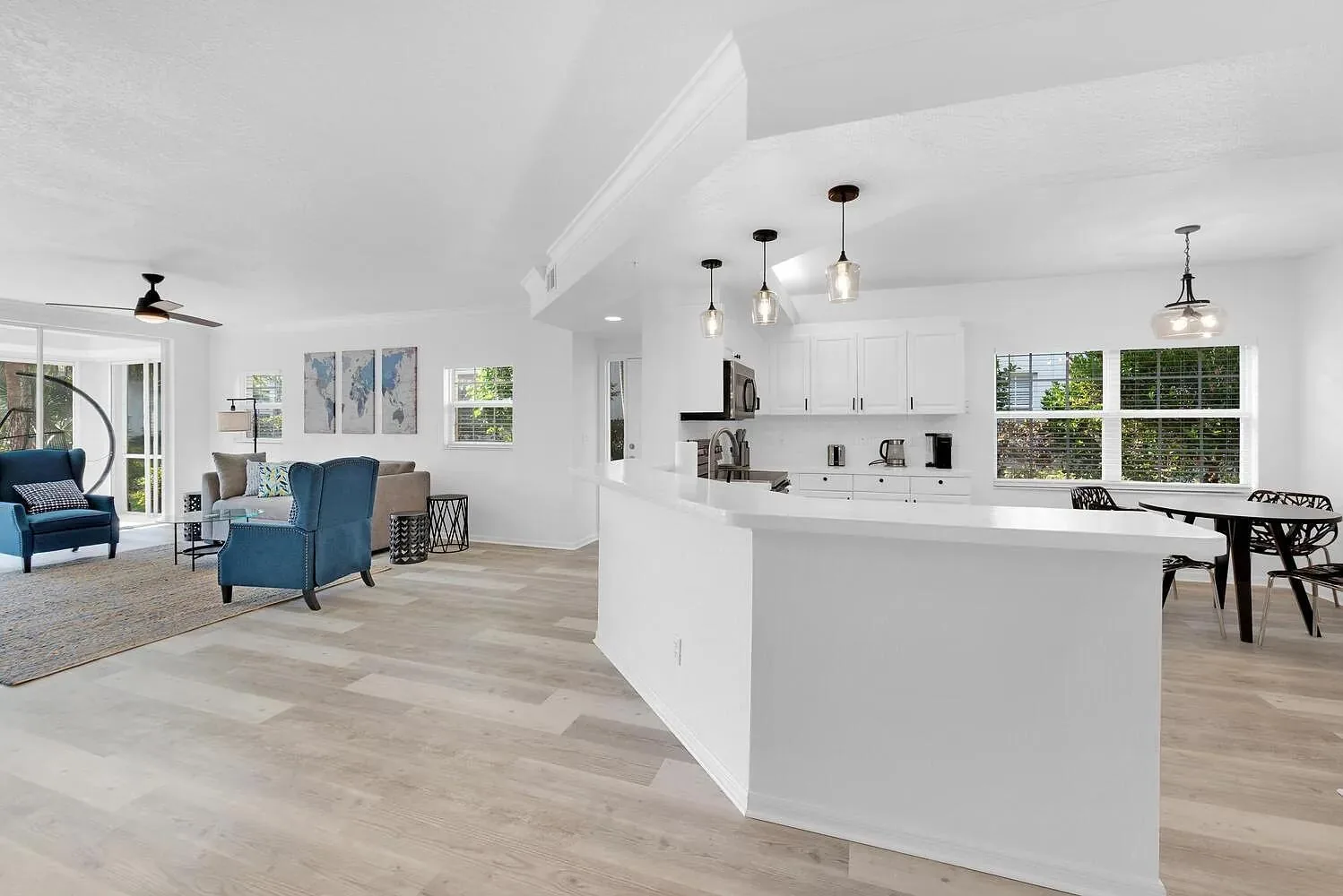Open living and dining area in furnished Naples condo